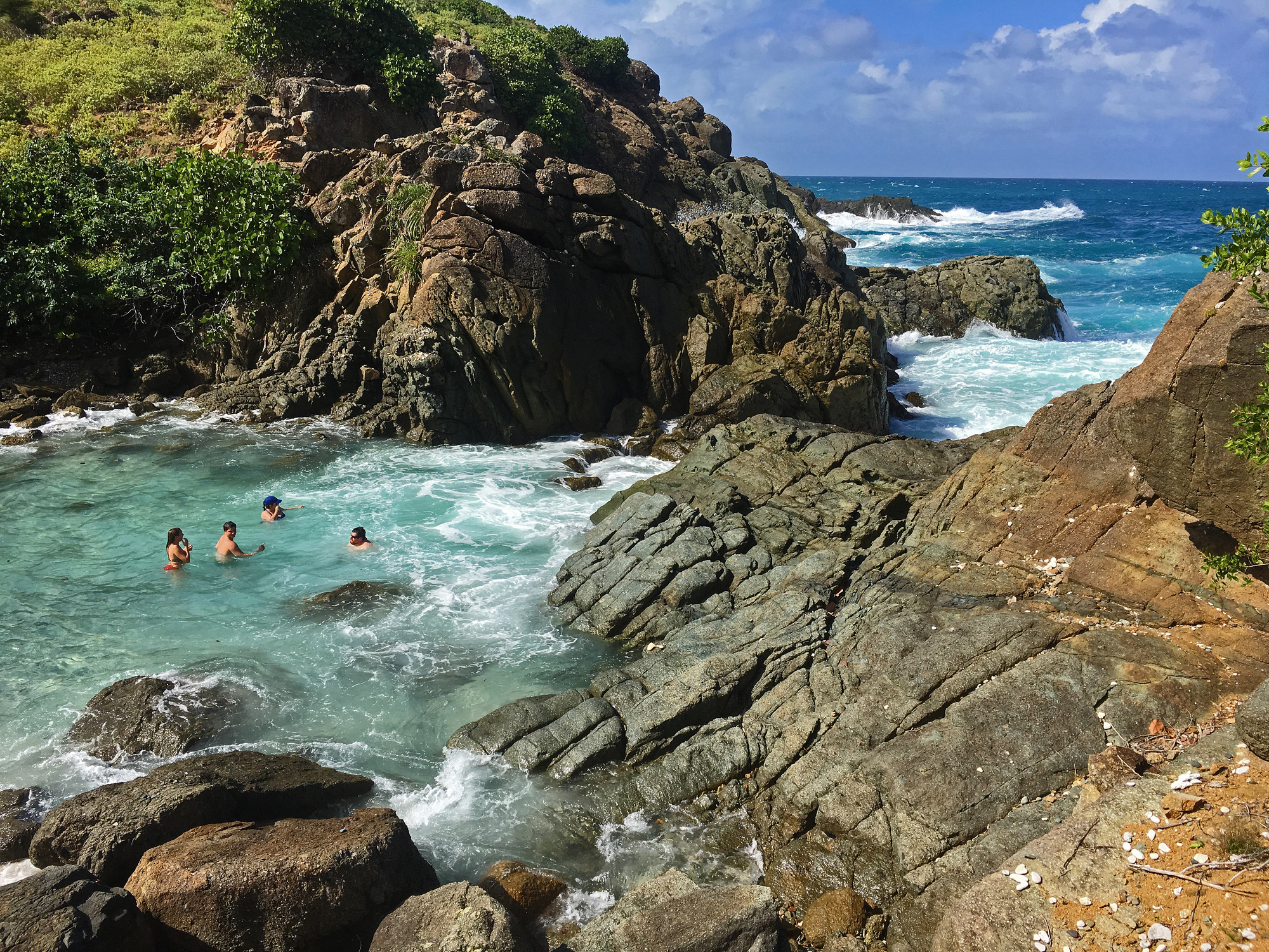 Guests enjoying the bubbly pools on Little Jost Van Dyke