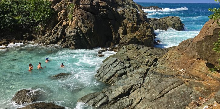 Guests enjoying the bubbly pools on Little Jost Van Dyke