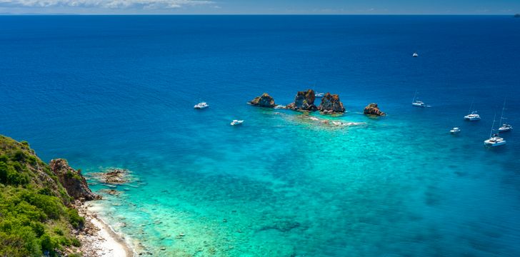 Crewed Power Catamarans Anchored at the Indians