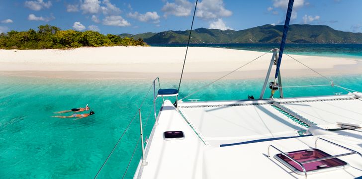 Guests Snorkelling off a Catamaran off Sandy Spit,BVI,Caribbean