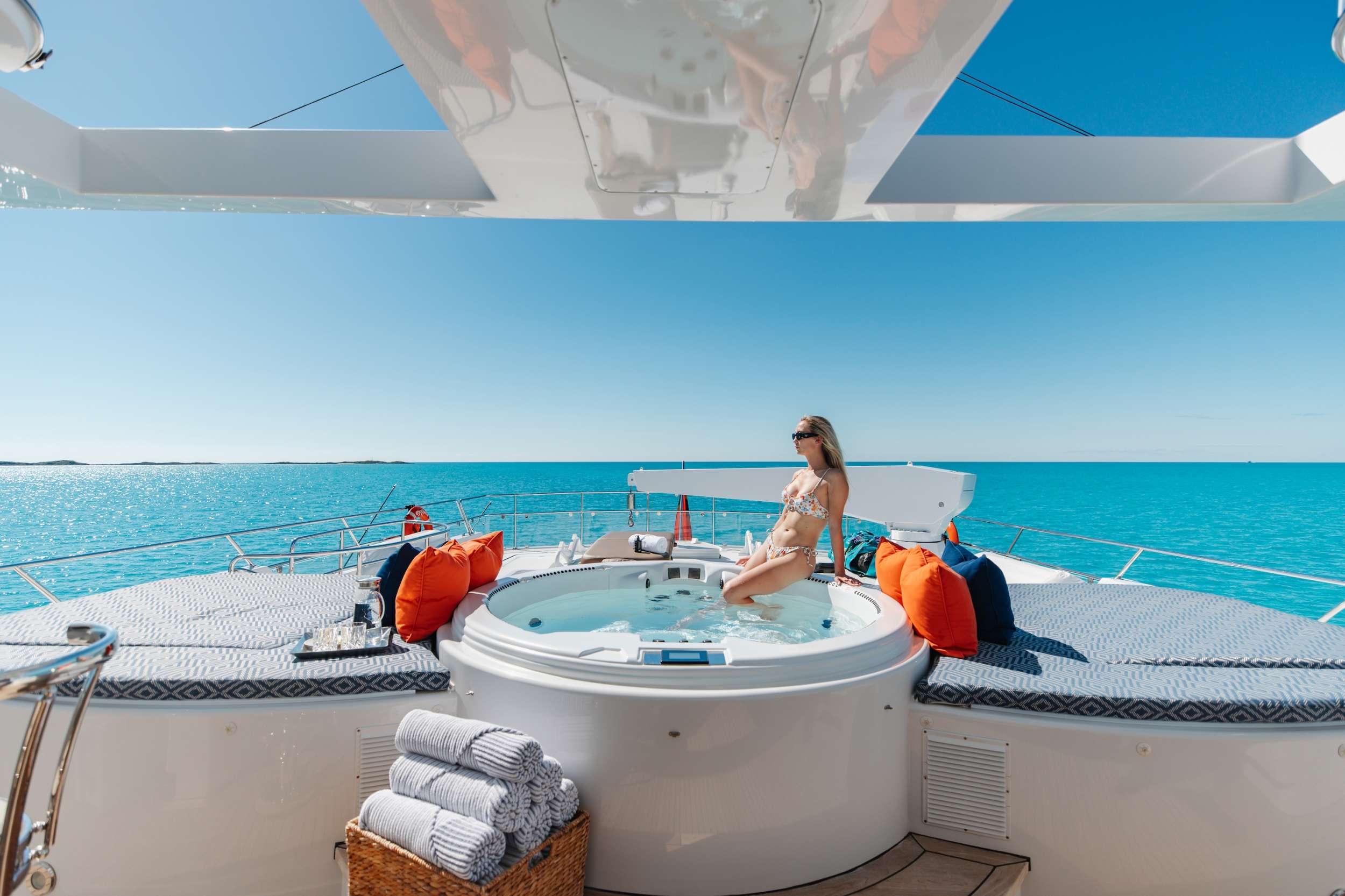 Relaxing in the Jacuzzi on a luxury crewed motor yacht in the Bahamas