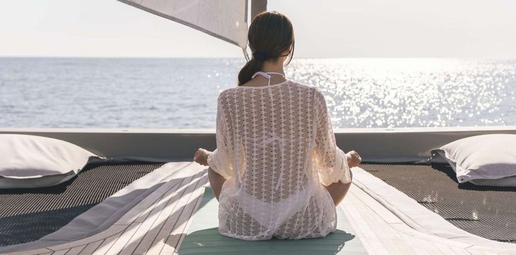 Morning Yoga on Board a Luxury Crewed Catamaran