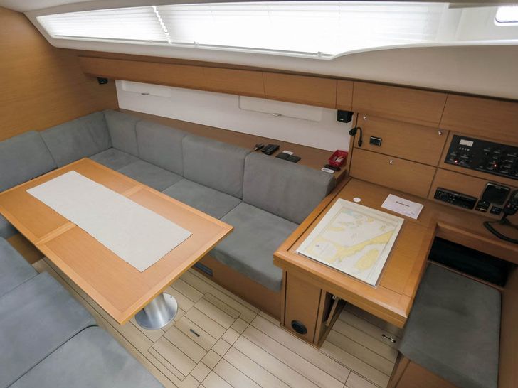 MISS C Jeannneau 54 - dining area and navigation station MISS C Jeannneau 54 - dining area and navigation station