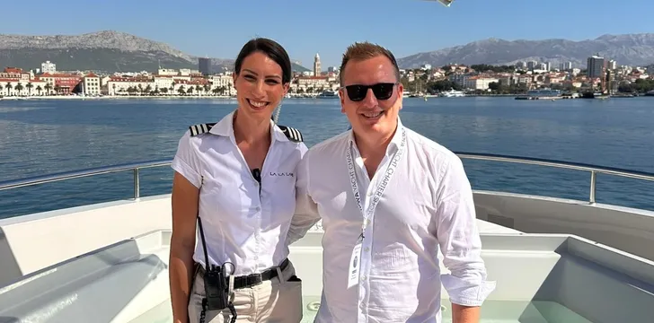 people on deck of yacht