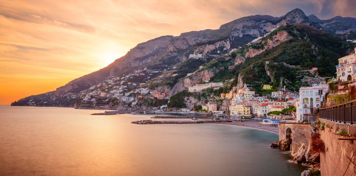 a beautiful sunset on the amalfi coast experienced on a luxury yacht