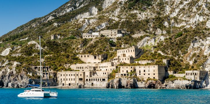 a catamaran anchored off the coast of lipari during a sicily yacht charter