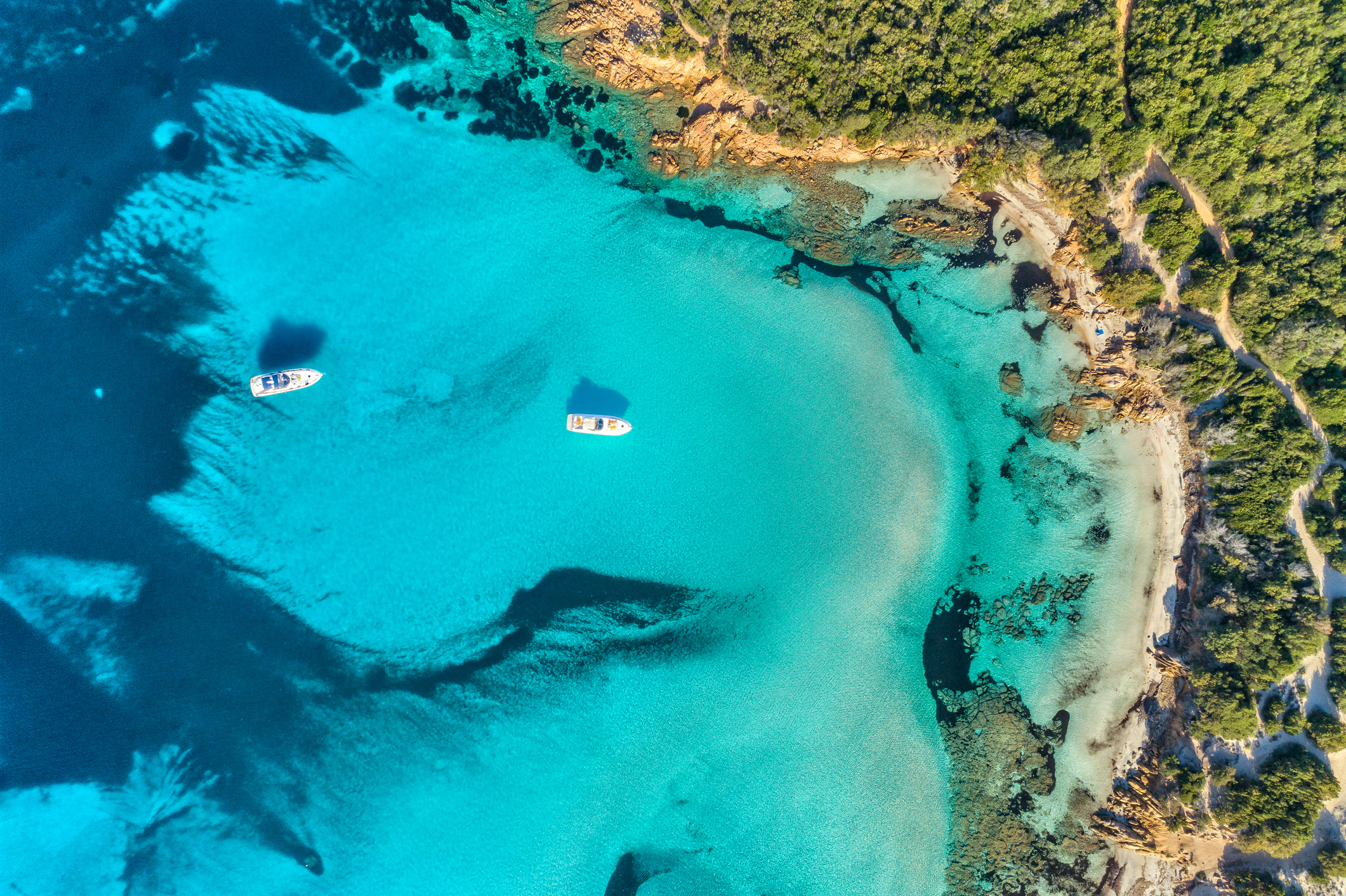 top aerial shot of sardinia's turquoise crystal clear waters